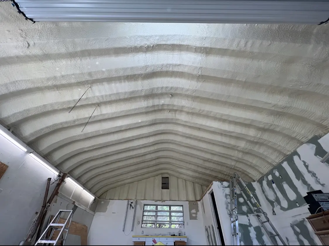 Spray polyurethane foam applied to the underside of a metal roof deck in Dyersburg